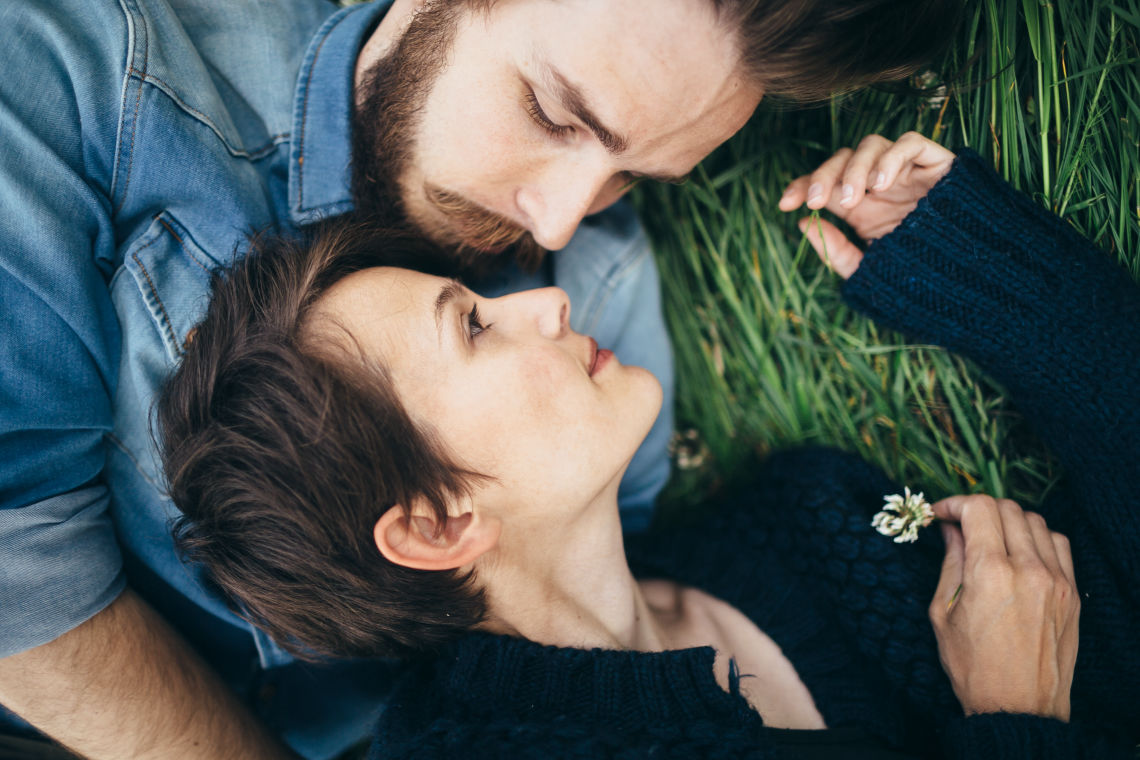 image-loving-couple-lying-on-grass